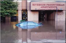  ?? Matt Rourke / Associated Press ?? A vehicle is under water during flooding in Philadelph­ia Sept. 2, in the aftermath of downpours and high winds from the remnants of Hurricane Ida that hit the area.