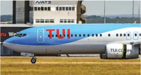  ??  ?? Jet-set: A passenger plane operated by tour firm Tui at Cardiff