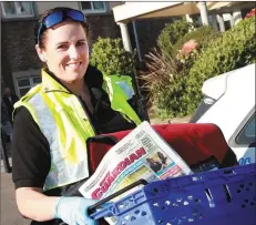  ??  ?? Garda Catherine Keogh heading off to make deliveries around Camolin, Ballycanew and Liskinfere.