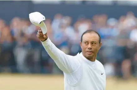  ?? PETER MORRISON/AP ?? Tiger Woods gestures to the crowd at the end of his second round of the British Open on Friday at St. Andrews, Scotland.