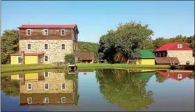  ?? SUBMITTED PHOTOS ?? Shown here is the Lobachsvil­le Grist Mill with mill pond in immediate foreground.