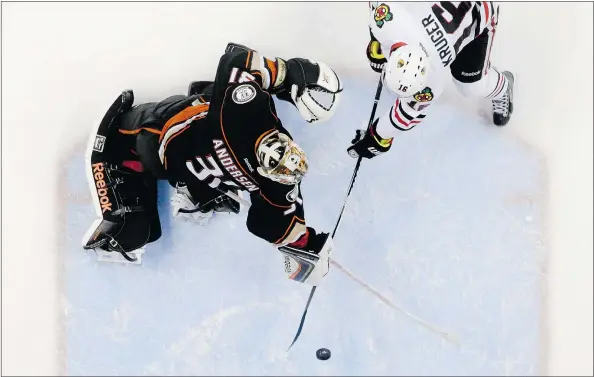  ?? — THE ASSOCIATED PRESS FILES ?? Blackhawks centre Marcus Kruger scores the game-winning goal past Anaheim Ducks goalie Frederik Andersen during the third overtime period in Game 2 of the Western Conference final in Anaheim on Tuesday. The win evened the series 1-1.