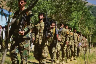  ?? Jalaluddin Sekandar / Associated Press 2021 ?? Militia members opposed to the ruling Taliban take part in a training exercise last year in Panjshir province in northern Afghanista­n. Fighting has escalated in the region since mid-May.