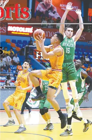  ?? PHOTO BY RUSSELL PALMA ?? Michael Calisaan of SSC-R shoots the ball past Edward Dixon of St. Benilde during the NCAA Season 93 basketball tournament on Friday at the FilOil Flying V Center in San Juan City.