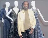  ?? DAMIAN DOVARGANES/AP ?? Kevan Hall with his “Galaxy Collection” at his haute couture atelier March 19 in West LA. He’s been getting calls from clients about dressed-up looks.