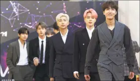  ?? Ahn Young-joon / AP ?? Kpop superstar group BTS is taking an extended break to “enjoy the ordinary lives of young people in their 20s, albeit briefly.”