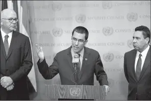  ?? AP/SETH WENIG ?? Venezuelan Foreign Minister Jorge Arreaza, (center) speaks to reporters Friday at the U.N., alongside Venezuela’s U.N. Ambassador Rafael Ramirez (left) and former Foreign Minister Samuel Moncada.