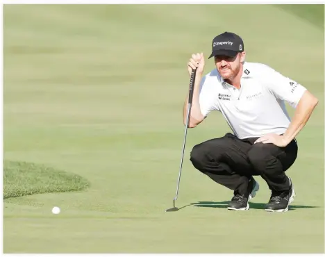  ??  ?? EARLY LEADER: PGA golfer Jimmy Walker lines up a putt on the tenth hole during the first round of the 2016 PGA Championsh­ip golf tournament at Baltusrol GC - Lower Course on Thursday. (USA TODAY Sports)