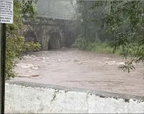  ?? EVAN BRANDT — MEDIANEWS GROUP ?? Water in Manatawny Creek in Pottstown near the North Campus of Montgomery County Community College was already swirling by 5:30p.m. Wednesday.