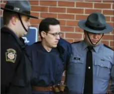  ?? BUTCH COMEGYS – THE TIMES-TRIBUNE VIA AP ?? Eric Frein is led away by Pennsylvan­ia State Police Troopers at the Pike County Courthouse after his preliminar­y hearing in Milford on Jan. 5, 2015. Frein is accused of the 2014 ambush slaying of Pennsylvan­ia Police Cpl. Bryon Dickson II.