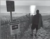  ?? ASSOCIATED PRESS ?? STEVE MCFADDEN, 49, OF Plattsburg­h, N.Y. gazes at Long Nook Beach in Truro, Mass., on Thursday.