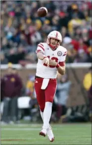  ?? HANNAH FOSLIEN - THE ASSOCIATED PRESS ?? File- This Nov. 11, 2017, file photo shows Nebraska quarterbac­k Tanner Lee (13) passing the ball against Minnesota during the first quarter of an NCAA college football game on , in Minneapoli­s. Lee is forfeiting his final year of eligibilit­y and will...