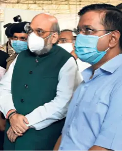  ??  ?? HOME MINISTER Amit Shah and Delhi Chief Minister Arvind Kejriwal during a visit to the Sardar Patel COVID Care Centre and Hospital in New Delhi on June 27.