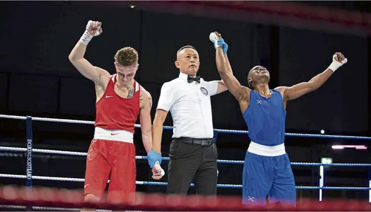  ?? ?? VICTORIOUS: Aberdeen 20-year-old Fawaz Aborode has his arms aloft after seeing off Lochend boxer Saul Sztor in Motherwell to take the lightweigh­t title.