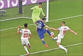  ?? ♦
ODD ANDERSEN/ AFP/Getty Images North America/TNS
STATES MEN’S NATIONAL TEAM ?? SOCCER|UNITED USA forward
Christian Pulisic (10)
scores his team’s first goal past
Iran goalkeeper
Alireza Beiranvand (1) during a Qatar 2022 World Cup Group B football match at the Al-Thumama Stadium in
Doha on
Nov. 29,
2022.