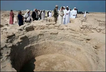  ?? ASSOCIATED PRESS ?? Sheikh Majid bin Saud Al Mualla (front right), chairman of the Umm Al Quwain Department of Tourism and Archaeolog­y, explains to Noura Al Kaabi, UAE Minister of Culture and Youth, during a Thursday visit of the ancient Christian monastery on Siniyah Island in Umm al-Quwain, United Arab Emirates.