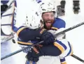  ?? GREG M. COOPER/USA TODAY SPORTS ?? Blues defenseman Carl Gunnarsson celebrates with left wing Pat Maroon (facing) after scoring the gamewinnin­g goal Wednesday night.