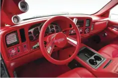  ??  ?? IF YOU’RE NOT A FAN OF RED, THE INTERIOR OF JULIO’S SILVERADO MIGHT JUST CHANGE YOUR MIND. PLENTY OF RED ULTRA-LEATHER AND SUEDE WERE USED TO TRANSFORM THE CAB, AND TOUCHES LIKE THE RACELINE EXPLOSION STEERING WHEEL AND BILLET ACCENTS ADD PLENTY OF...