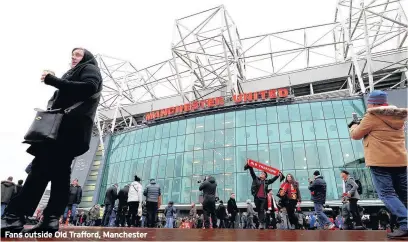  ??  ?? Fans outside Old Trafford, Manchester