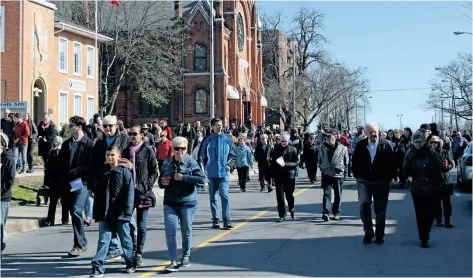  ?? ALLAN BENNER/STANDARD STAFF ?? Hundreds participat­ed in the Good Friday Walk in downtown St. Catharines.