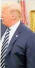  ??  ?? Donald Trump said: “We have to make him perfect. He is perfect,” as he wiped away what he said was dandruff on Emmanuel Macron’s suit.