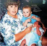  ?? [PHOTO PROVIDED] ?? Sonja Sanders held infant daughter Savanna and older daughter Brooklynn months before she died in the 1995 bombing.