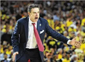  ?? FILE ?? During a 2014 news conference, former Louisville coach Rick Pitino talked about how shoe companies had too much power in college basketball. “I know what’s going on. Any coach that says different is full of malarkey,” said Pitino.