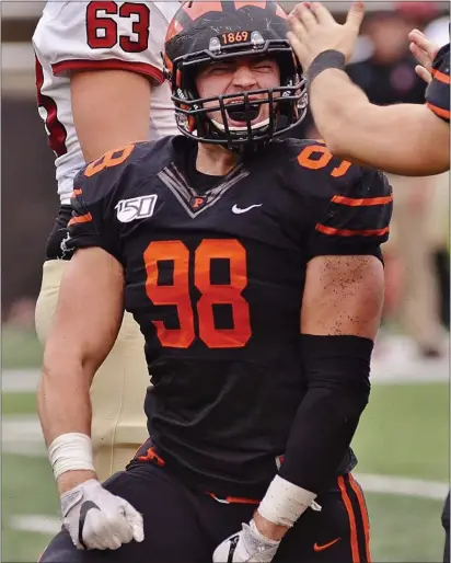  ?? KYLE FRANKO — TRENTONIAN PHOTO ?? Princeton defensive lineman Joey DeMarco (98) reacts after sacking Harvard quarterbac­k Jake Smith during the fourth quarter of an Ivy League game on Saturday.