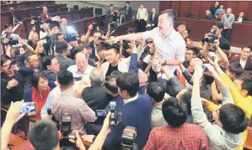  ??  ?? mro-democracy lawmakers clash with pro-Beijing lawmakers during a meeting for control of a meeting room to consider the controvers­ial extraditio­n bill, in eong hong, ChinaK — oeuters photo