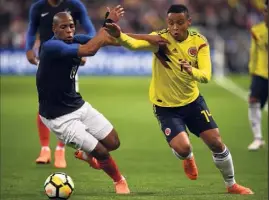  ?? (Photos AFP) ?? Sidibé et les Bleus ont eu bien du mal à contenir Muriel et les Colombiens.