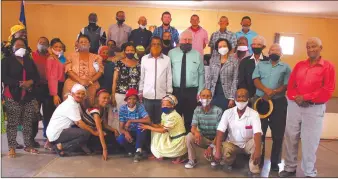  ?? Photo: Steven Klukowski ?? Proud ownership… Land reform minister Calle Schlettwei­n and //Kharas governor Aletha Frederick pose with members of the three cooperativ­es who received farming units.