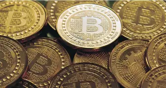  ?? KAREN BLEIER/AFP/GETTY IMAGES FILES ?? Bitcoin was among the investment­s that stole the show.. The price of a single digital token shot up nearly 2,000 per cent to a mid-December high just short of US$20,000 as bitcoin and its crypto imitators gained mainstream acceptance, with the launch of bitcoin futures in December.