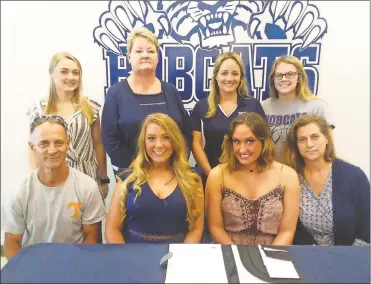  ??  ?? On hand at Georgia Northweste­rn to see Dalton High School senior Maggie Scruggs (seated, second from left) sign on to become a member of the Cheer Cats was Will Scruggs, Sara Hoover and Robin Scruggs. Also there for the ceremony was GNTC Cheer Cat...