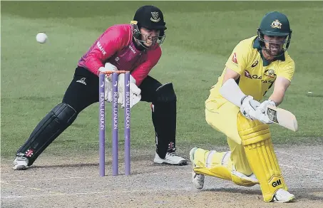  ??  ?? Marcus Stoinis hits out on his way to a century for Australia in yesterday’s friendly against Sussex. The Aussies won by 57 runs.