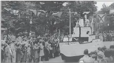  ?? KINGS COUNTY MUSEUM ?? The Village of Port Williams’ Grand Street Parade float from 1950 is pictured passing the Cornwallis Inn in Kentville.