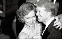  ?? IRA SCHWARZ/AP 1978 ?? Then-president Jimmy Carter and his wife, Rosalynn, dance at the 1978 Congressio­nal Christmas Ball at the White House in Washington.
