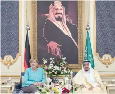  ?? — Reuters ?? Saudi Arabia’s King Salman bin Abdulaziz al Saud and German Chancellor Angela Merkel attend a deal signing ceremony in Jeddah, Saudi Arabia, on Sunday.