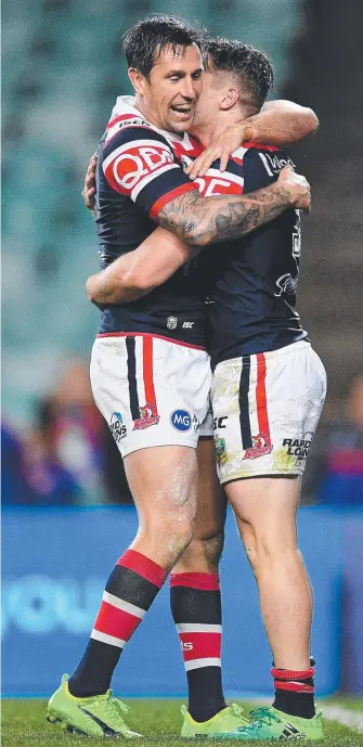  ?? Picture: AAP IMAGE ?? Mitchell Pearce (left) had a lot more to cheer about last night as he put on a classy performanc­e in his club colours as the Roosters thumped Newcastle. PAUL CRAWLEY