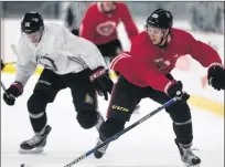  ??  ?? Ottawa Senators Thomas Chabot (left) chases Pius Suter during a scrimmage on the second day of training camp on Sept. 15 in Ottawa.