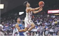  ?? CHARLES KRUPA/ASSOCIATED PRESS ?? Boston College guard Derryck Thornton, right, drives to the basket past Duke guard Tre Jones during the second half of Tuesday’s game in Boston.