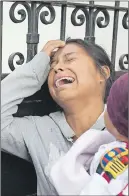  ?? AP PHOTO ?? A relative of a youth who resided at the Virgin of the Assumption Safe Home wails as she waits for the release of the names of those who died in a fire at the shelter.