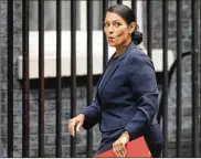  ?? ALASTAIR GRANT / ASSOCIATED PRESS ?? Priti Patel, then Britain’s secretary of state for internatio­nal developmen­t, reacts to a media question last month as she arrived for a Cabinet meeting at 10 Downing Street in London.