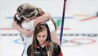  ?? ASSOCIATED PRESS FILE PHOTO ?? Canada skip Rachel Homan, centre, leaves the ice as Britain’s Lauren Gray, right above, and Vicki Adams embrace celebratin­g winning a match at the 2018 Winter Olympics in Gangneung, South Korea, in February.