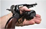  ?? (YouTube) ?? The cylinder assembly of a Remington New Army is removed in seconds by simply placing the hammer in the half-cocked position, lowering the load lever, and sliding the cylinder pin forward