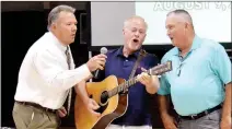  ?? TIMES photograph by Annette Beard ?? School superinten­dent Rick Neal and teachers Mike Harrod and Perry Mason, all with more than three decades of experience sang “”You’ve lost that loving feeling” to inspire their peers to know why they do what they do — for the love of the students.