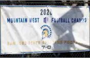  ?? RANDY VAZQUEZ — BAY AREA NEWS GROUP ?? A sign hangs outside of the San Jose State University football teams’ facility promoting the teams conference championsh­ip in San Jose.