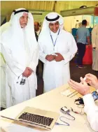  ??  ?? KUWAIT: Deputy Chairman of Kuwait Chamber of Commerce and Industry (KCCI) Abdulwahab AlWazan tours the inventions fair. — KUNA