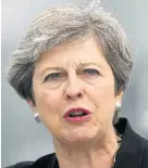  ??  ?? > Theresa May yesterday