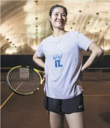  ?? Brittainy Newman / New York Times ?? Li Na, who won two Grand Slam titles, makes an appearance for the New York’s City Parks Foundation, for whom she conducted a tennis clinic for children, on Thursday ahead of her Internatio­nal Tennis Hall of Fame induction Saturday.