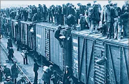  ??  ?? Jobless men jump boxcars to an Ottawa protest at the onset of the Depression.